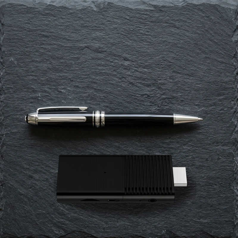 Flixy TV Stick compact physical scale alongside ballpoint pen